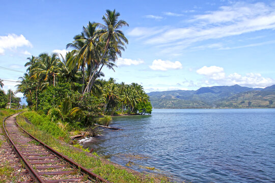 Lake Singkarak as seen from the eastern side of the lake with a railway track in West Sumatra, Indonesia.