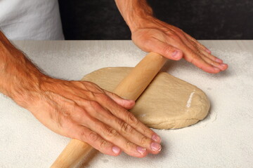 Rolling dough. Making Flatbread.