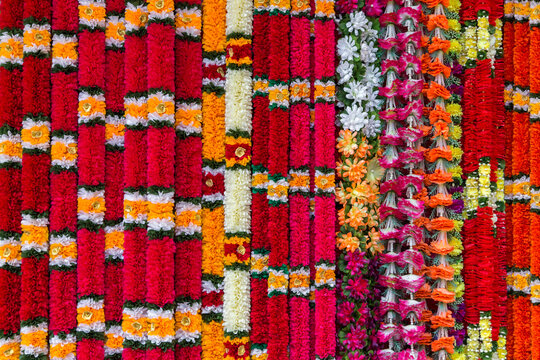 Selection of traditional Indian flower garlands used as offerings in Hindu religious ceremonies. Background