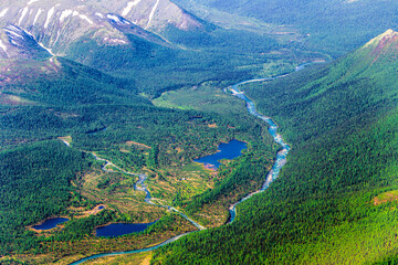 Confluence of two mountain rivers. Aerial view. Picturesque mountain landscape