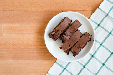 Chocolate brownie on cutting board