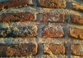 Reddish construction, texture. Ancient and genuine wall. Solid red clay brick very old.