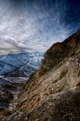 Fototapeta na wymiar view of spiti valley, india with blue sky and brown rocky and snow mountains with an abstract look