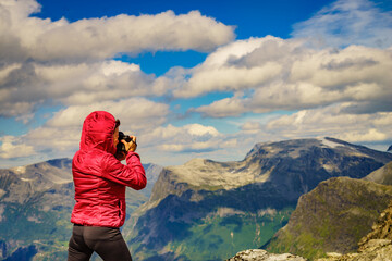 Fototapeta na wymiar Tourist taking photo from Dalsnibba mountain, Norway