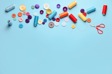 Sewing supplies on color background