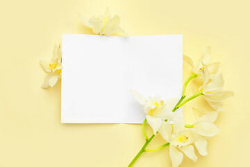 Blank card with flowers on color background