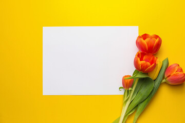 Blank card with flowers on color background