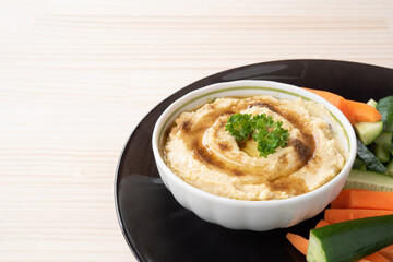 Homemade hummus with cucumber and carrot