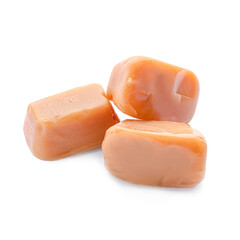 Tasty caramel candies on white background