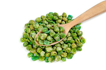 Green peas roasted in wooden spoon isolated on white background