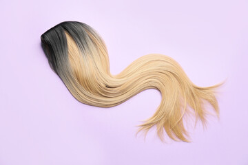 Long wig on color background