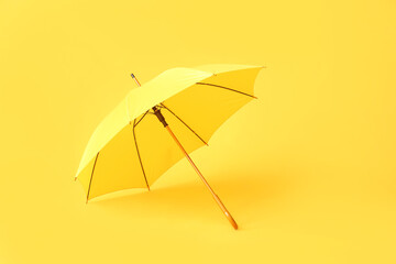 Stylish umbrella on color background