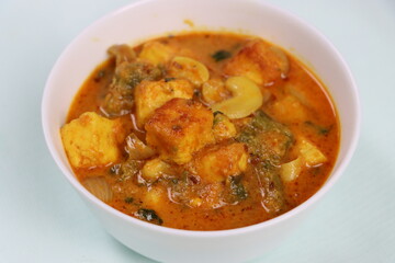 Paneer Kaju Masala, spicy cottage cheese indian curry with cashew and capsicum in coconut gravy