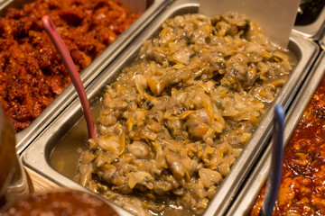 Korean traditional food salted pickled clams in market.