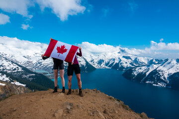 Whistler BC Canada.July 2017.celebration Canada day with Canada flag with Garibaldi lake...