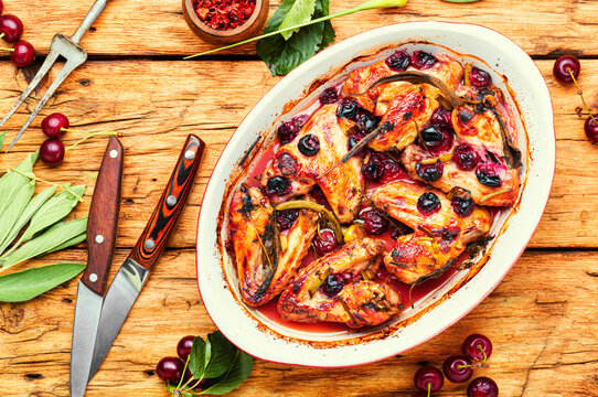 Chicken wings with cherries.