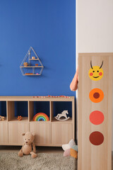 Stylish interior of modern playroom in kindergarten