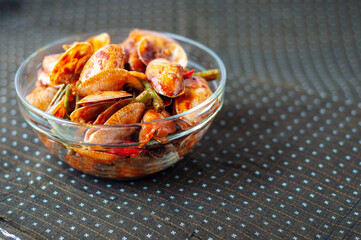 Spicy Paphia textile, or known as retak seribu lala fried with chillies. Served in a bowl. selective focus.