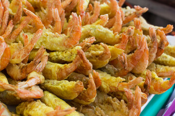 pile of shrimp tempura in the market.