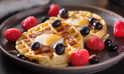 breakfast plate with waffles and berries