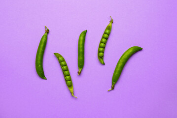 Tasty fresh peas on color background