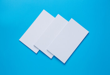 Blank business cards on color background