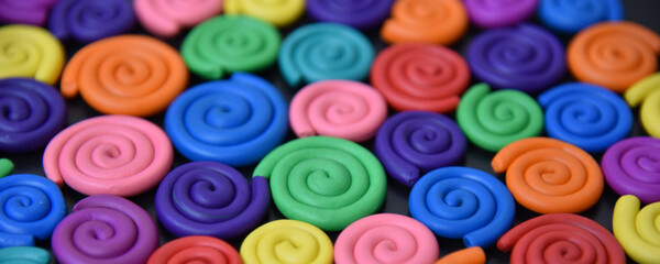 Bright colorful background of plasticine elements.