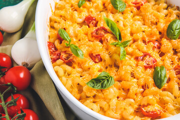 Tasty baked pasta in dish on table