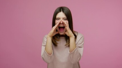 Stressed out, upset brunette woman holding hands around mouth and shouting with loud voice, screaming announcement, pissed off and got rid of aggression. indoor studio shot isolated on pink background