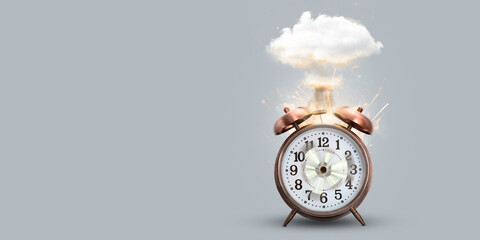 Funny alarm clock exploding with a mushroom cloud