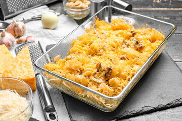 Tasty baked pasta in dish on table