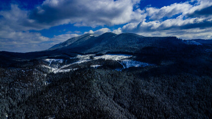 Carpathian mountains mountain range pine forests coniferous mountain tops winter snow aerial photography