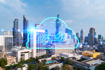 Storage cloud hologram over panorama city view of Bangkok, tech hub in Asia. The concept of developing new approaches to store digital information. Double exposure.