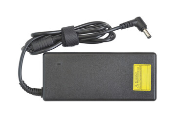 Power adapter. AC to DC converter for laptop. Black plastic rectangular box with cable and L-shaped connector 5.5 by 2.5 mm. Top view. Isolated on white.