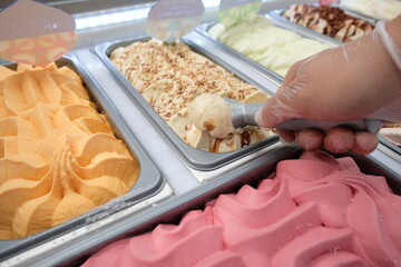 Almaty / Kazakhstan - 08.08.2018 : Shopping stalls selling ice cream with different fillings and...