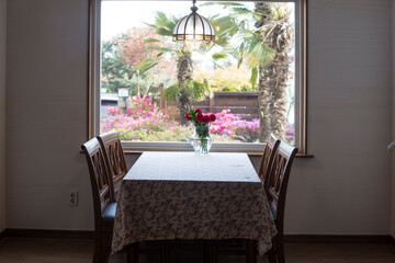 A table with in front of a large window.