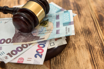 Uah, ukraine money with wooden gavel