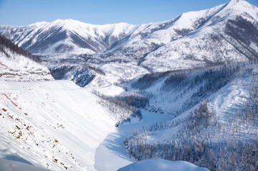 Scenic winter landscape of Kolyma Highway (Road of Bones) with amazing Verkhoyansk mountain Range...
