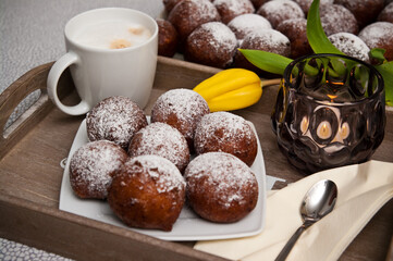 Fat Thursday homemade donuts on a plate, delicious Polish sweet food