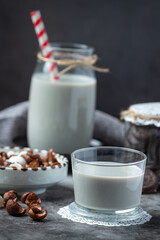 milk products tasty healthy dairy products on a table on sour cream in a bowl, cottage cheese bowl, cream in a a bank and milk jar, glass bottle and in a glass.