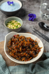 Dried clams, served with three flavored sauce served with steamed rice Asian Seafood Concept.