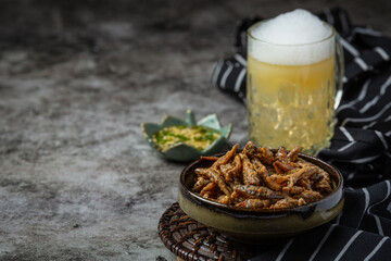 Beer with crispy fish hors d'oeuvres, World Beer Day.