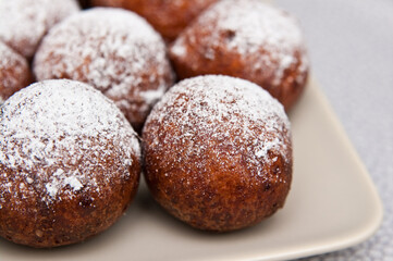 Fat Thursday homemade donuts on a plate, delicious Polish sweet food