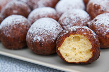 Fat Thursday homemade donuts on a plate, delicious Polish sweet food