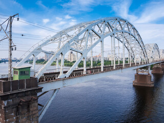 Steel arch trusses of the railroad bridge across the river