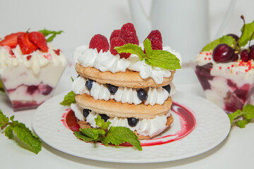 Beautiful dessert with raspberries, blackberries and strawberries and mint