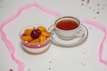 Beautiful dessert with berries: cherry, peaches and mint