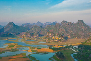 Sunset View of Puzhehei, a typical karst landscape in Yunnan, China.