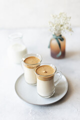 Obraz na płótnie Canvas Iced Dalgona Coffee, a trendy fluffy creamy whipped coffee