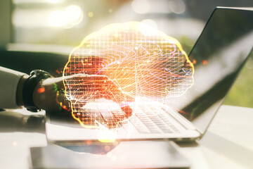Double exposure of creative human brain microcircuit with hand typing on computer keyboard on background. Future technology and AI concept